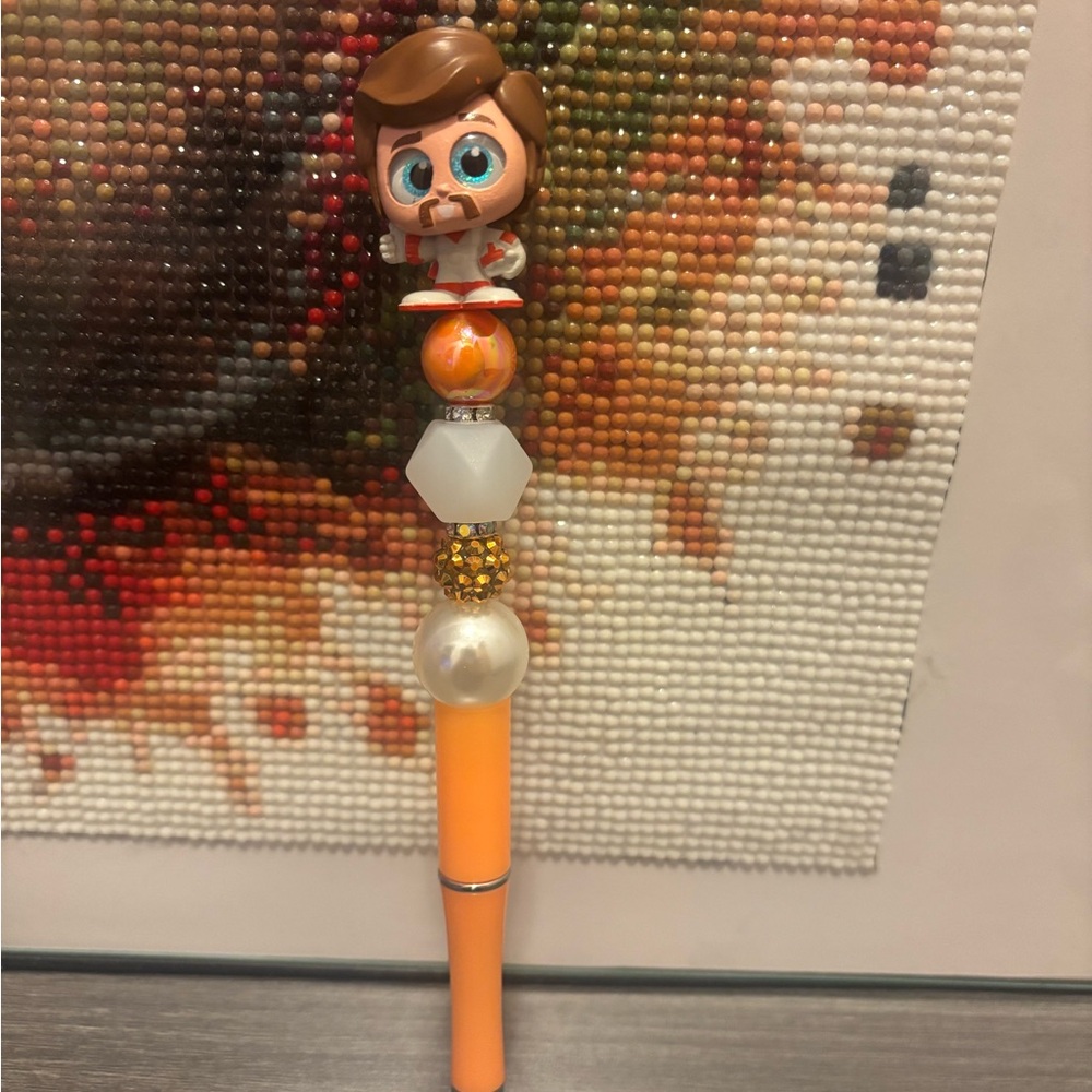 Orange Beaded Pen with Duke Caboom Topper
